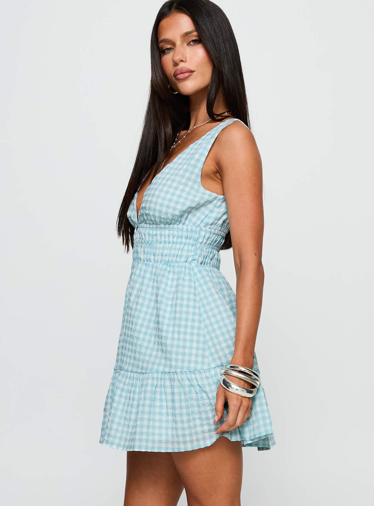 side view of model wearing Princess Polly Ismena Plunge Mini Dress Blue Check Plunger 