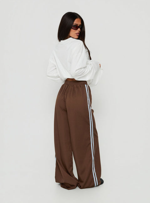 Presenting the Fielder Track Pants Brown / Blue womens-regular-pants featuring high-rise back view of model wearing Princess Polly