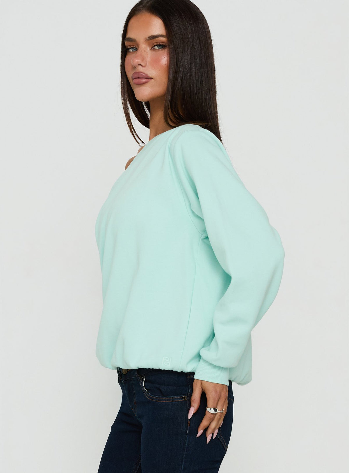 Designed with pale turquoise Wellness Off The Shoulder Sweatshirt womens-jumpers featuring oversized fit, boat neckline and short length side view of model wearing