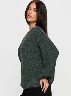 Displaying the Delyn Off Shoulder Slouchy Knit Sweater in Black Marle, a womens jumper with short length side view of model wearing Princess Polly