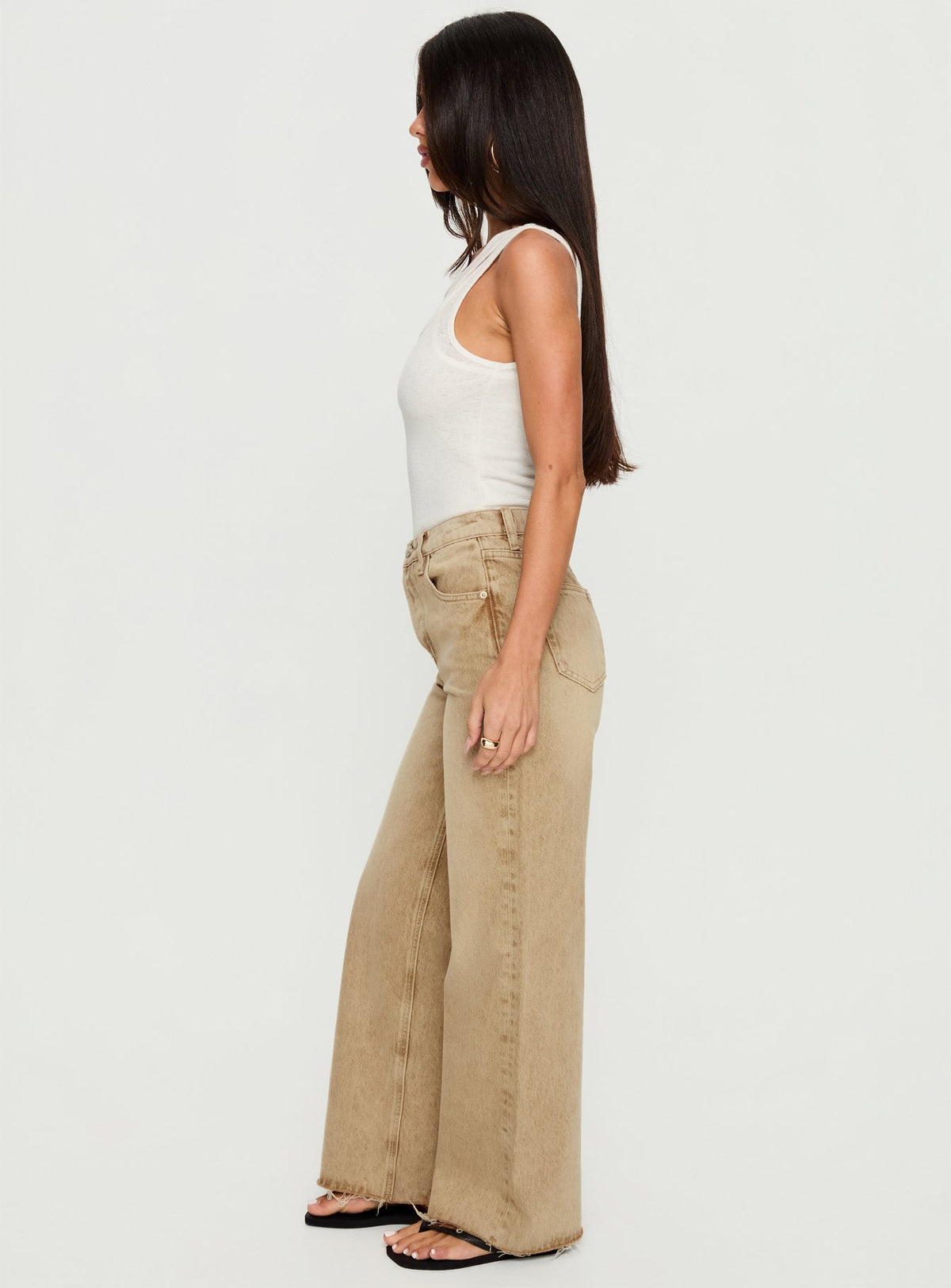 side view of model wearing Princess Polly Fawcett High Rise Straight Leg Jeans Tan High Rise Jeans Jeans 