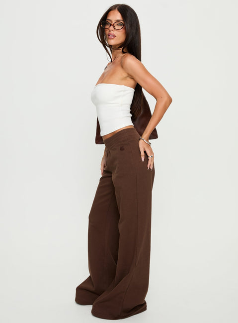 side view of model wearing Princess Polly Summits Flared Track Pants Chocolate High Rise Pants Pants 