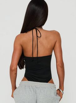 Featuring the Ezekiel Bodysuit Black with sleeveless silhouette, square halter neckline and thick straps, back view of model wearing Princess Polly