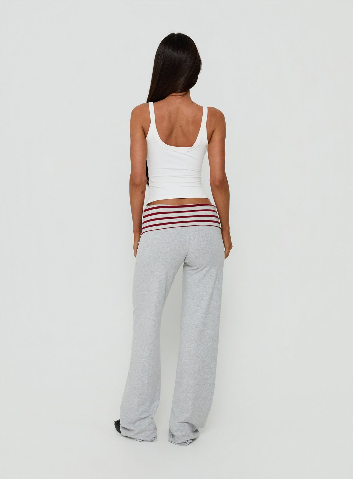 Designed with Jetset Pants Grey Red Stripe in womens regular pants featuring mid-rise striped wide-leg cut back view of model wearing Princess Polly