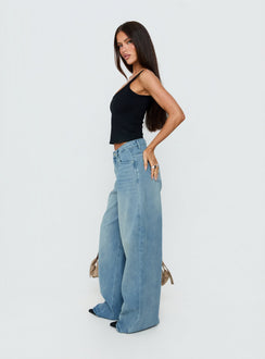 Captured in Naylor Mid Rise Wide Leg Jeans Light Wash Denim Tall womens-jeans with mid-rise side view of model wearing Princess Polly
