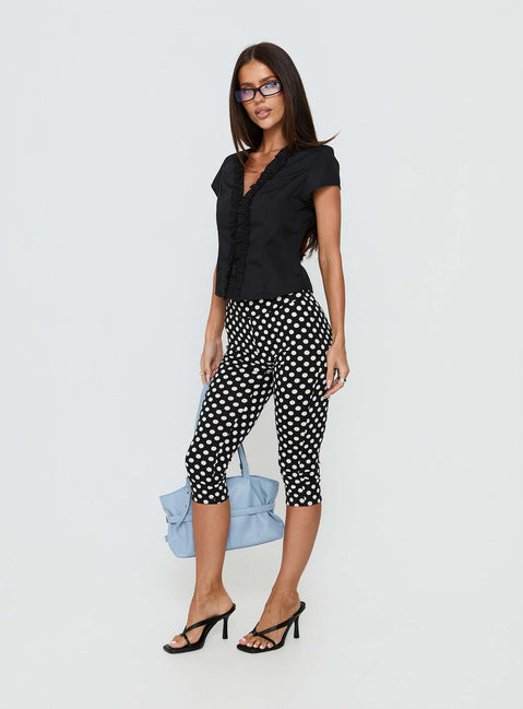 back view of model wearing Princess Polly Isadonna Capri Pants Black Polka Dot Mid Rise Pants Pants 