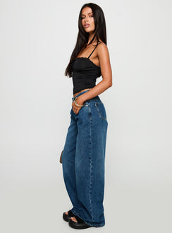 side view of model wearing Princess Polly Duster Mid Rise Baggy Jeans Dark Wash Mid Rise Jeans Jeans 