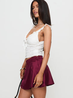   side view of model wearing Princess Polly For Me Mini Skirt Burgundy Mini Skirts Skirts 