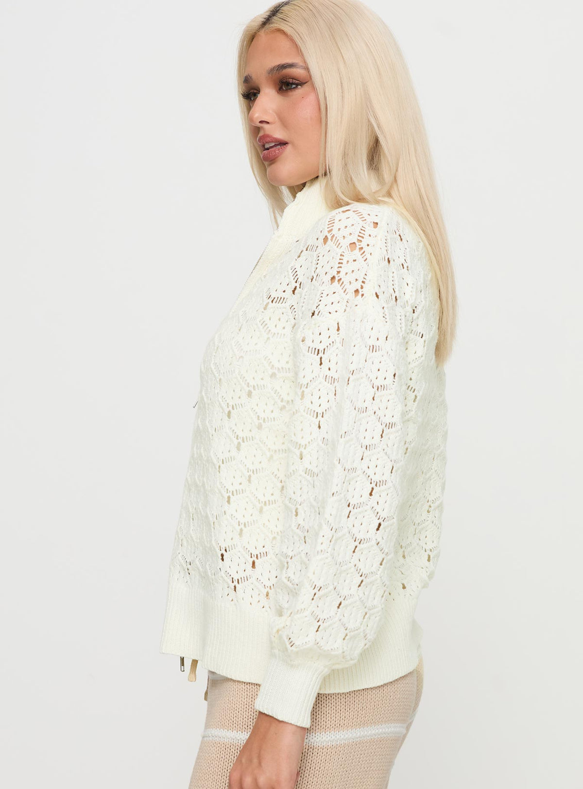 side view of model wearing Princess Polly Sirena Zip Through Knit Sweater Cream Jumpers 