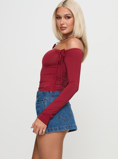   side view of model wearing Princess Polly Nicolina Low Rise Denim Mini Skirt Light Wash Petite Mini Skirts Skirts 