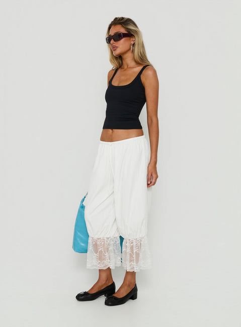 Designed with Daiana Lace Culotte Pants Cream womens-regular-pants in mid-rise side view of model wearing
