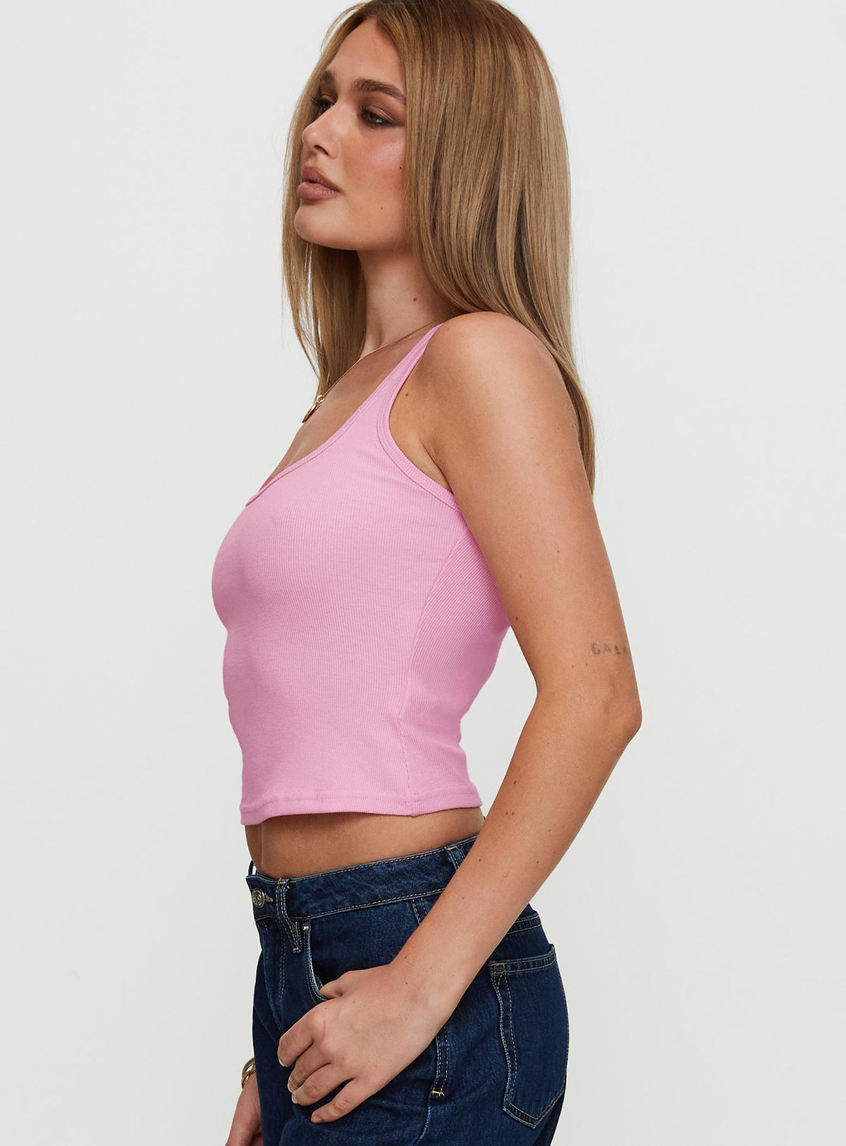 side view of model wearing Princess Polly Baseline Square Neck Rib Tank Top Pale Pink Sleeveless Scoop Neck 