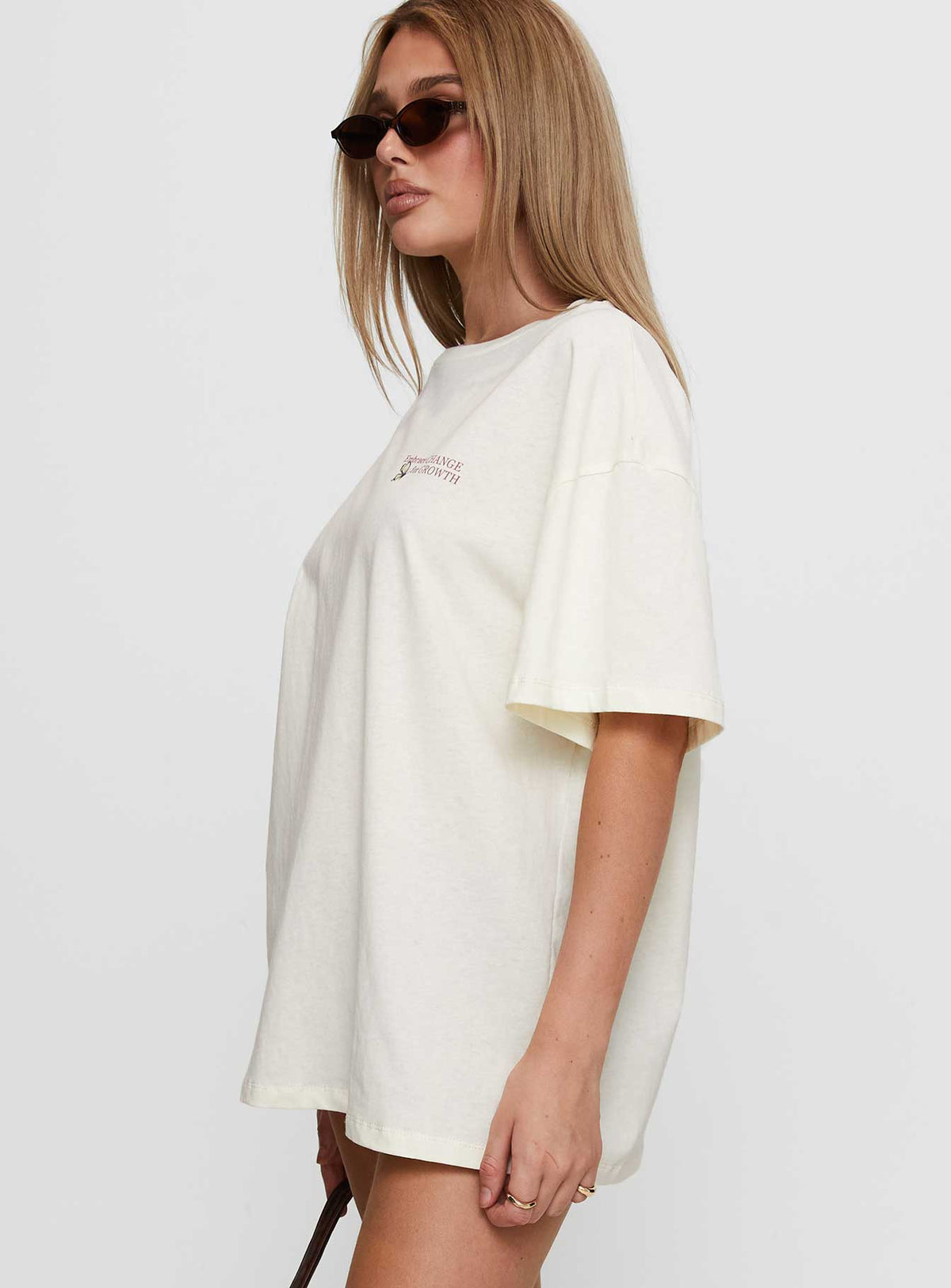 side view of model wearing Princess Polly Princess Polly x Butterfly Foundation Charity Merch Tee Cream Half Sleeves Crew Neck 