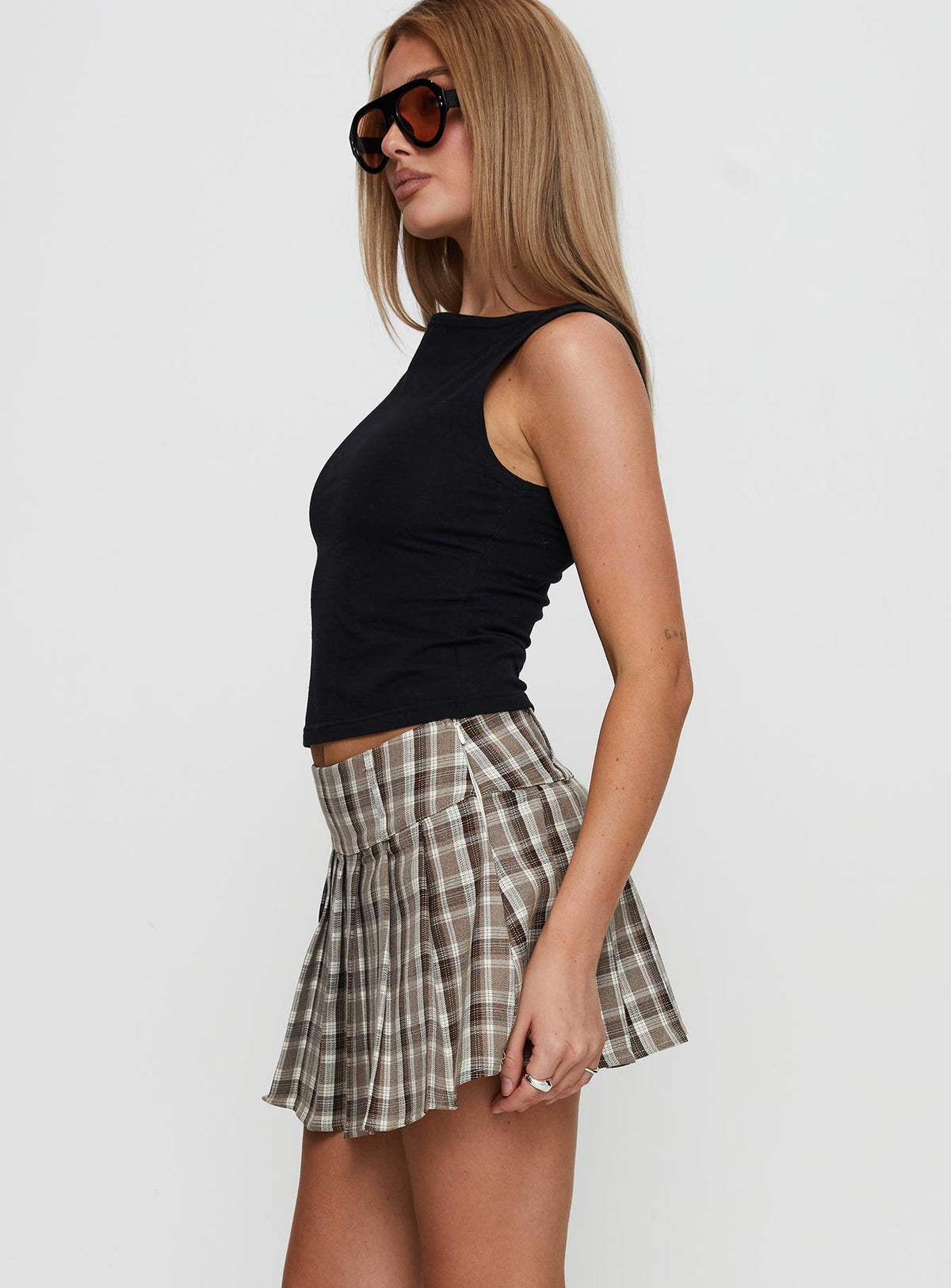   side view of model wearing Princess Polly Envision Pleat Mini Skirt Brown Multi Mini Skirts Skirts 