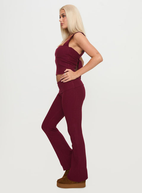 side view of model wearing Princess Polly Closed Eyes Flared Pants Maroon Low Rise Pants Pants 