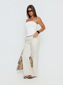 side view of model wearing Princess Polly Around The Clock Button Detail Mid Rise Wide Leg Pants Cream Mid Rise Pants Pants 