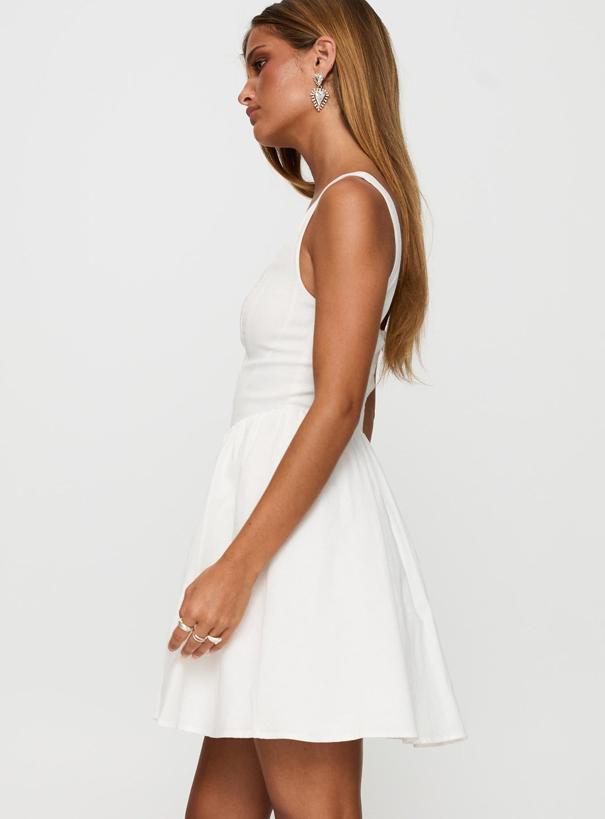 side view of model wearing Princess Polly Martie Mini Dress White Scoop Neck 