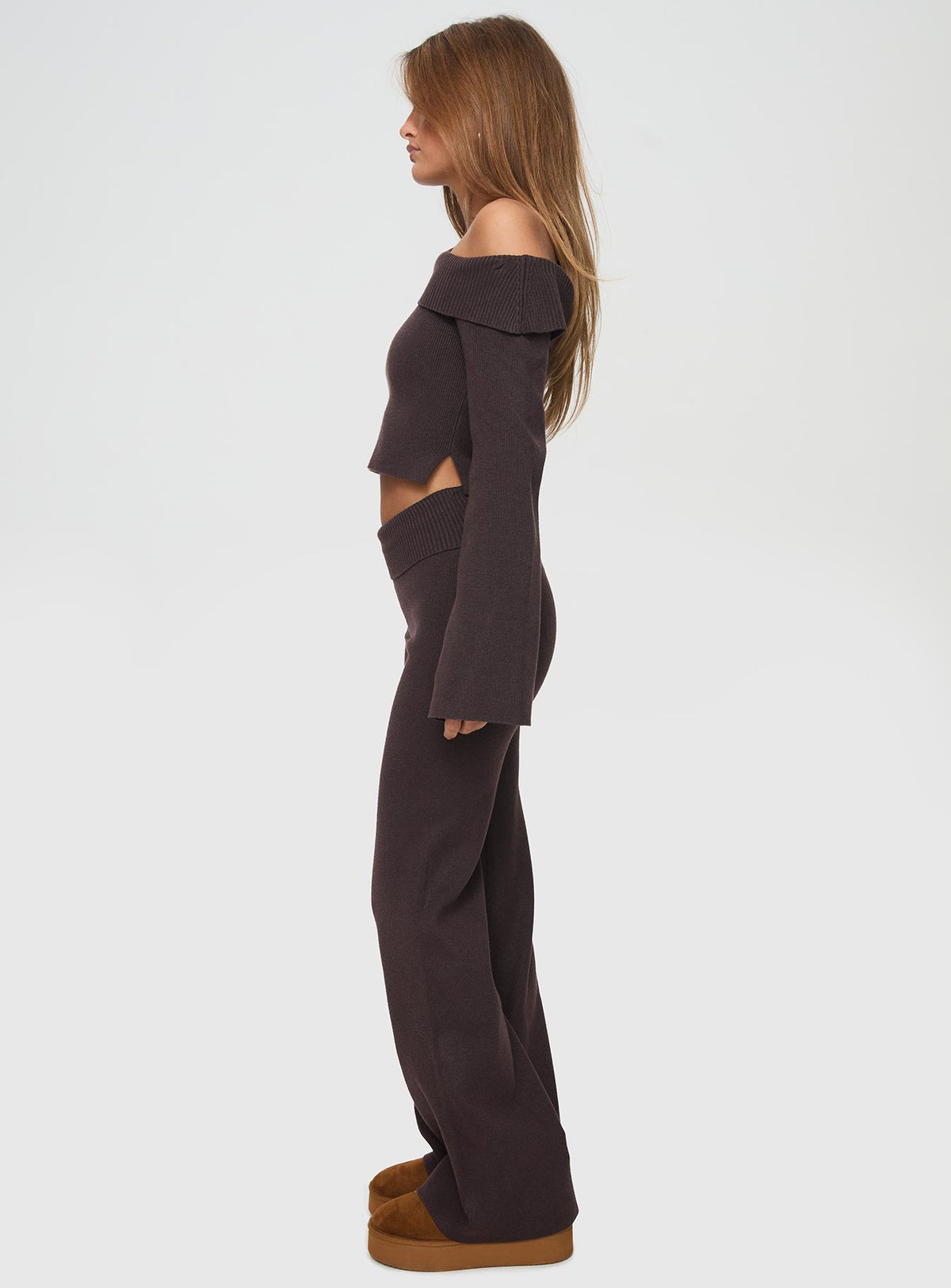 side view of model wearing Princess Polly Sina Off The Shoulder Top Chocolate Full Sleeves Asymmetric Neckline 