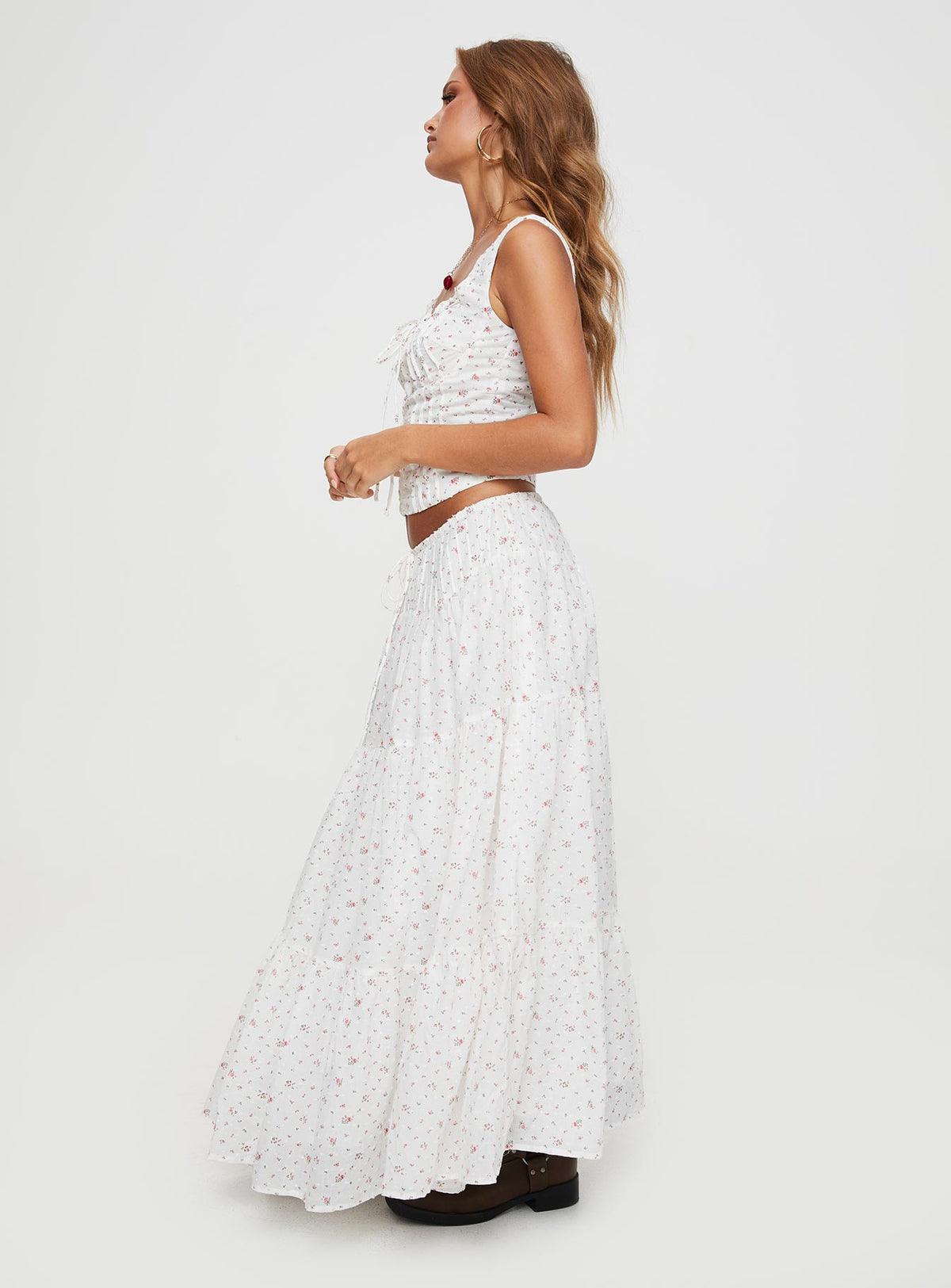   side view of model wearing Princess Polly Cherry On Top Maxi Skirt White Floral Midi Skirts Skirts 