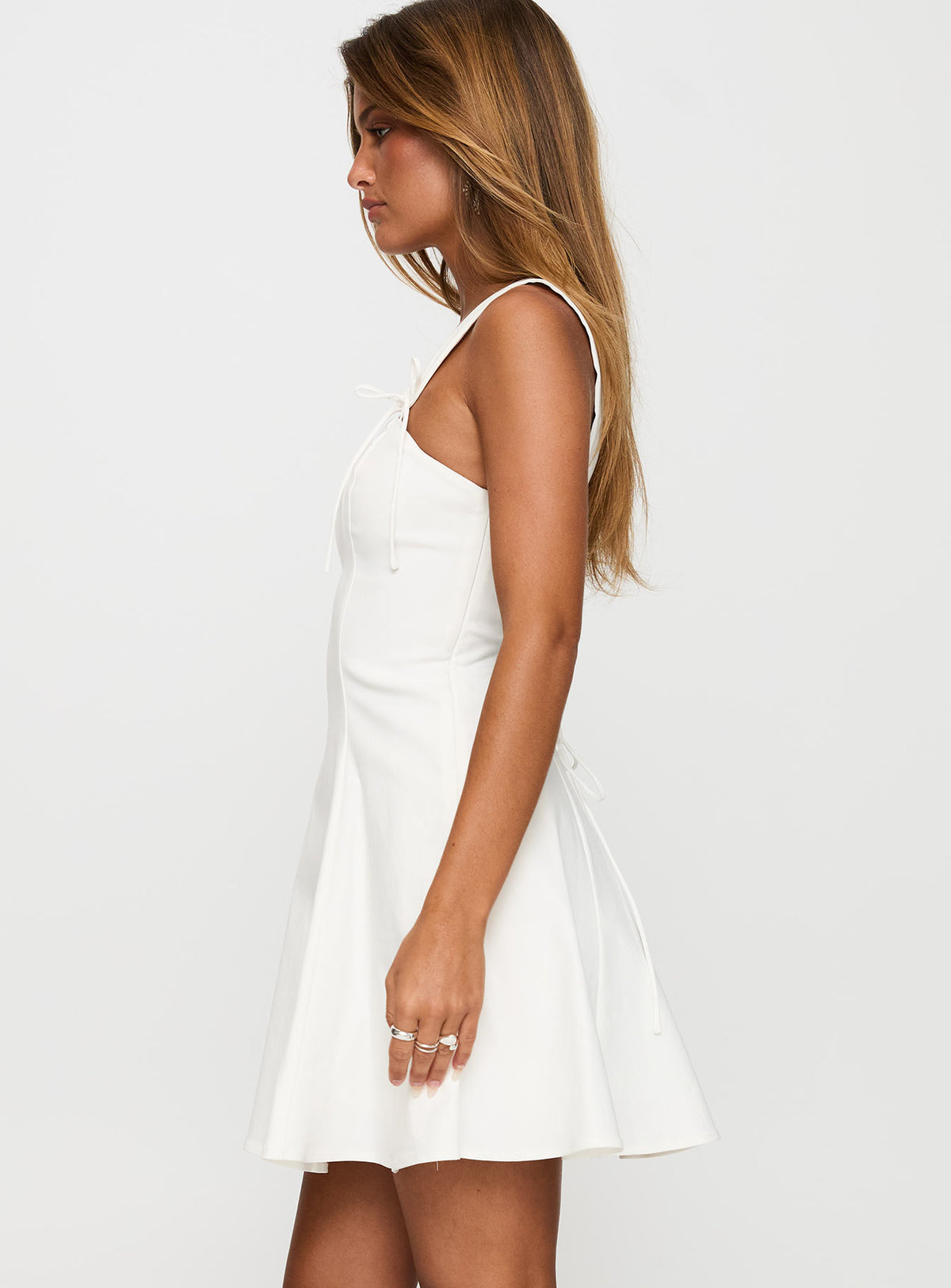 side view of model wearing Princess Polly Honey Suckle Tie Up Mini Dress White Square Neck 