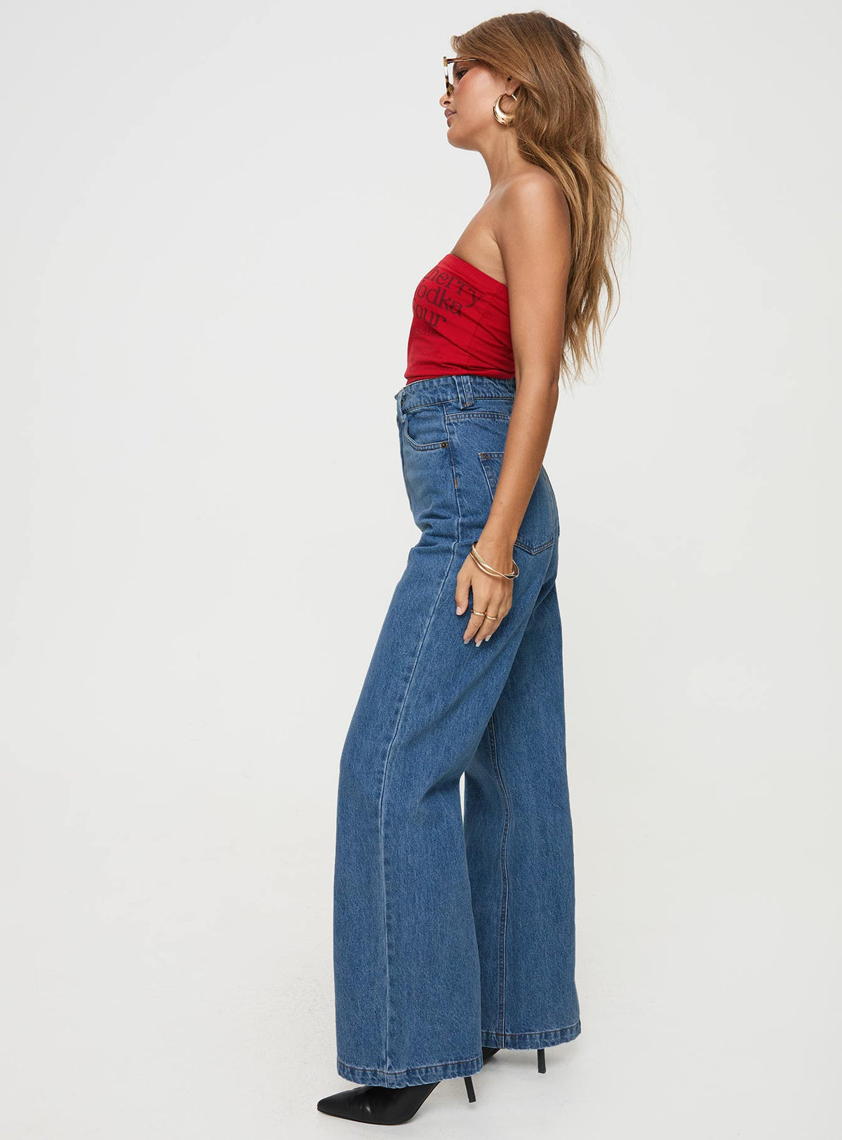 side view of model wearing Princess Polly Zephee High Rise Wide Leg Jeans Light Wash High Rise Jeans Jeans 