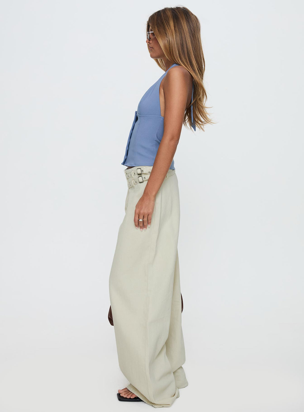 side view of model wearing Princess Polly Paltrow Cargo Jeans Cream Low Rise Jeans 