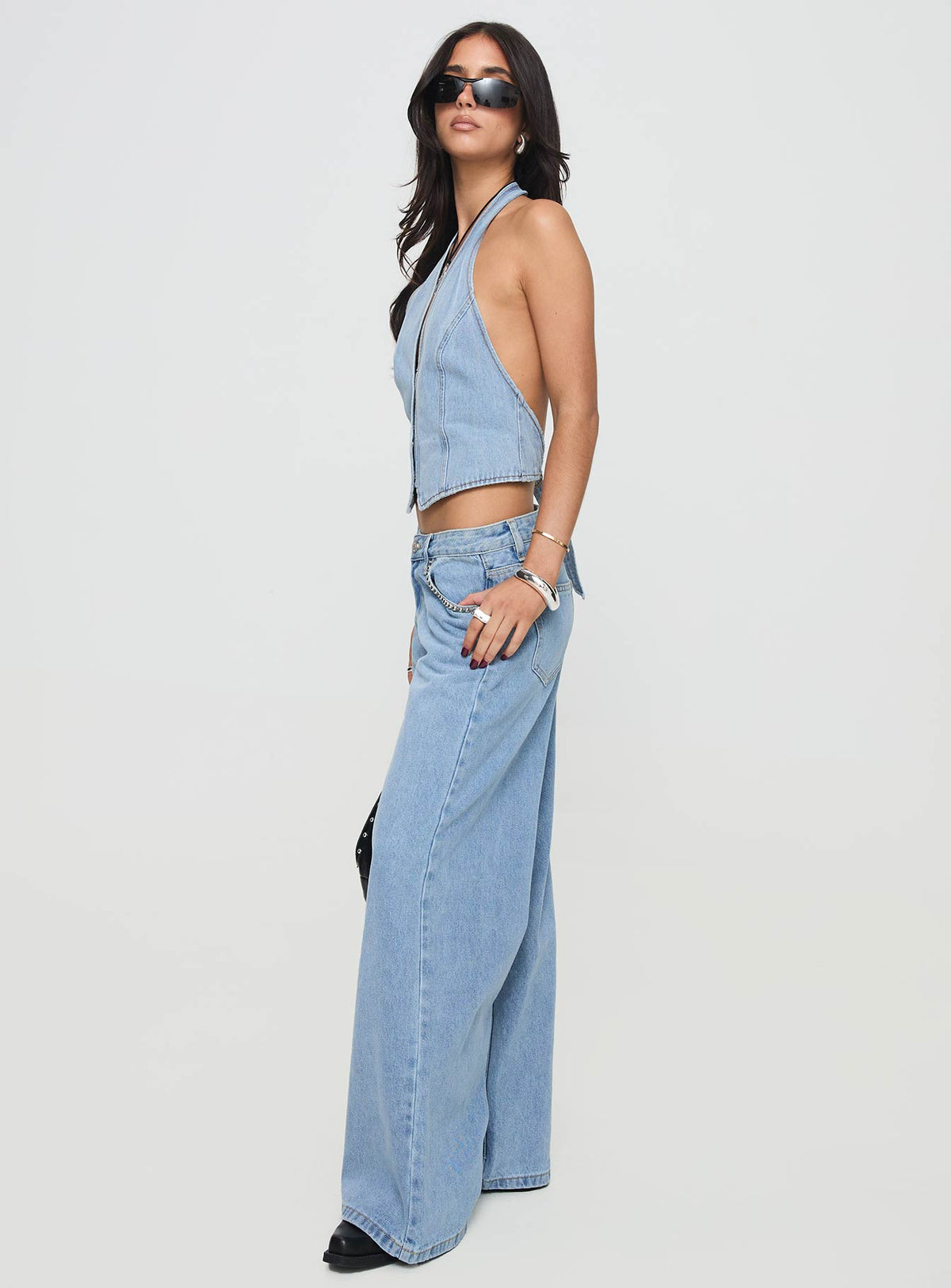 side view of model wearing Princess Polly Pearlisle Low Rise Baggy Jeans Light Wash Low Rise Jeans Jeans 