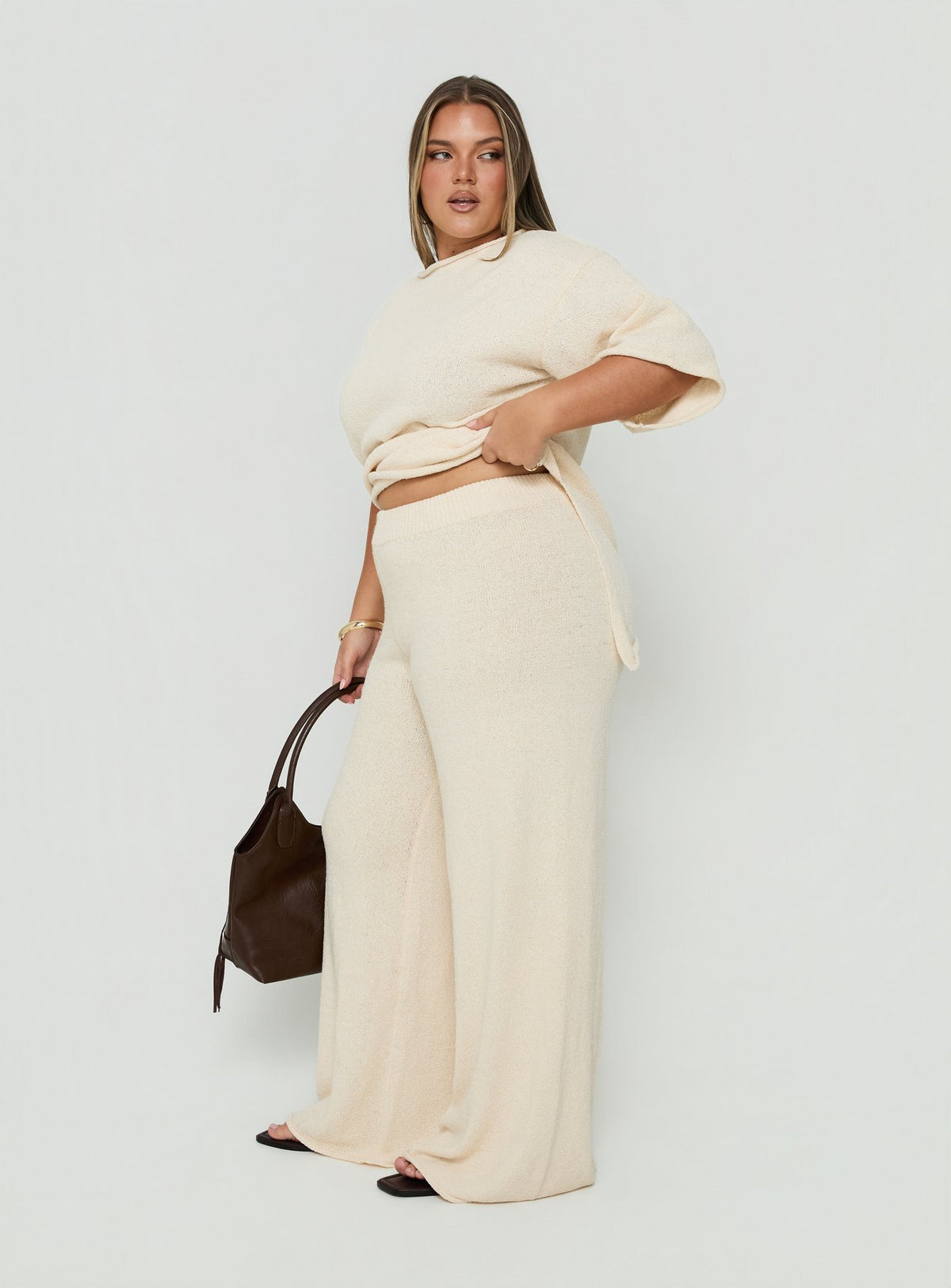Presenting Calisse Knit Wide Leg Pants Beige Curve womens-regular-pants with high-rise side view of model wearing