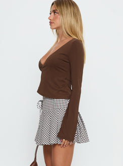   side view of model wearing Princess Polly Nikoleta Pleat Mini Skirt Brown / White Check Mini Skirts Skirts 