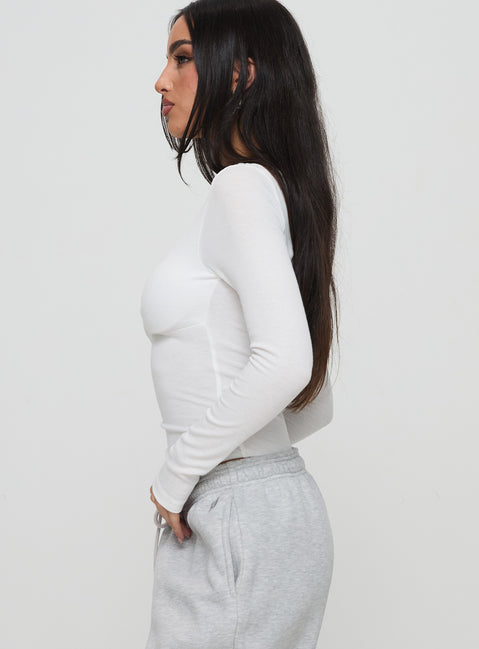 side view of model wearing Princess Polly Lunella Bodysuit White Long Sleeve Tops Bodysuit 
