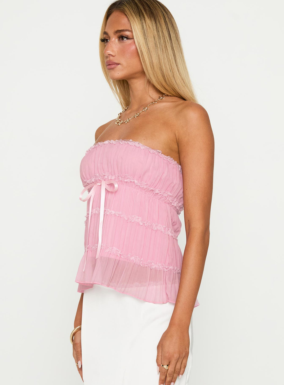 side view of model wearing Princess Polly Avelina Strapless Top Pink Sleeveless straight 