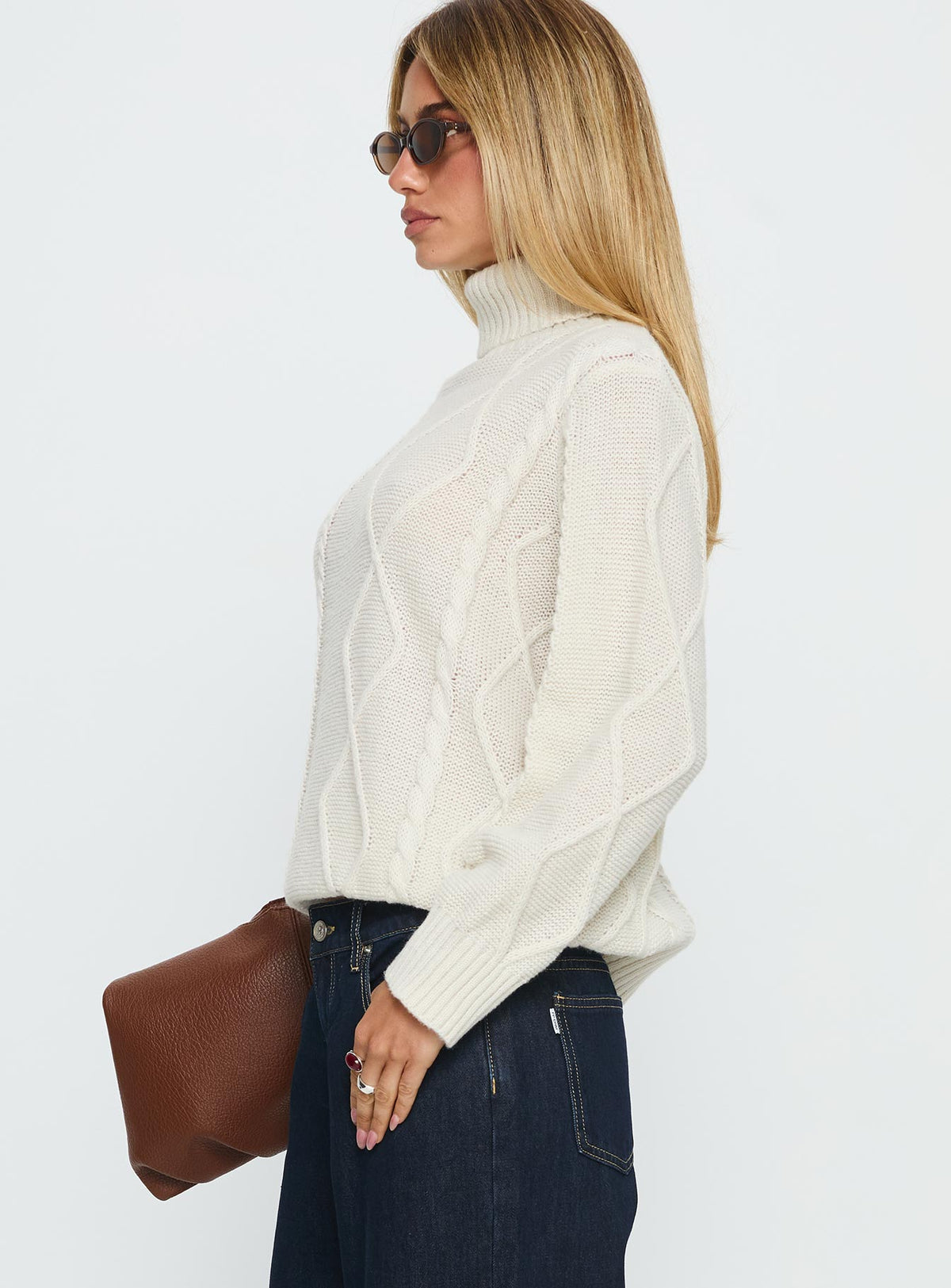 side view of model wearing Princess Polly Tarynne Cable Knit Turtle Neck Sweater Beige Longline Jumpers Jumpers 