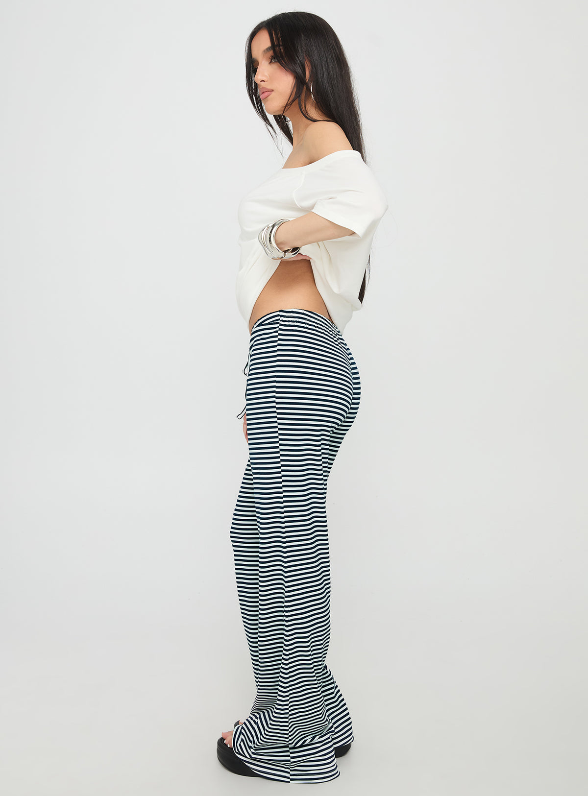 side view of model wearing Princess Polly Alfreda Jersey Pants Navy Stripe High Rise Pants Pants 