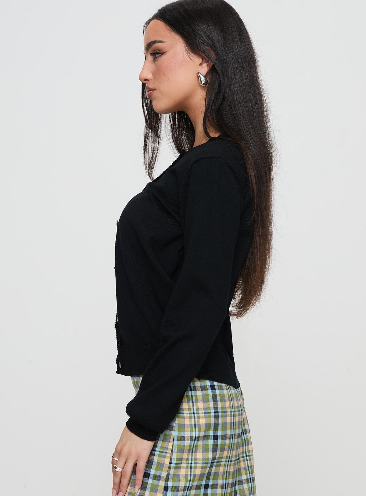 side view of model wearing Princess Polly Capeside Knit Cardigan Black Cropped Jumpers Jumpers 