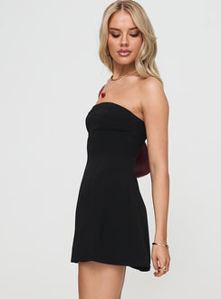side view of model wearing Princess Polly Riccoli Mini Dress Black Straight Neck 
