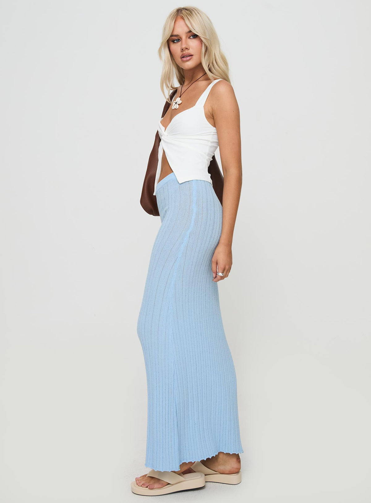   side view of model wearing Princess Polly Belle Knit Maxi Skirt Baby Blue Maxi Skirts Skirts 