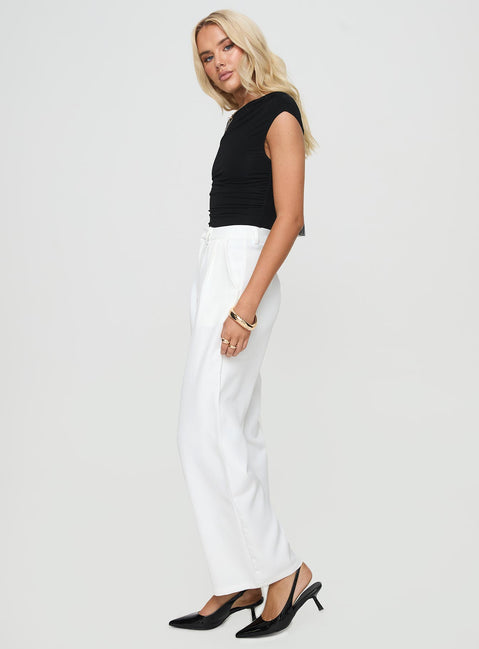 side view of model wearing Princess Polly Jazzar Pocket Detail Pleated Pant White Petite High Rise Pants Pants 