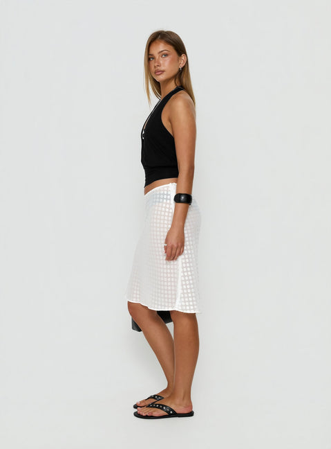 Presenting the Evangela Sheer Midi Skirt White Polka Dot womens-skirts in midi length side view of model wearing Princess Polly