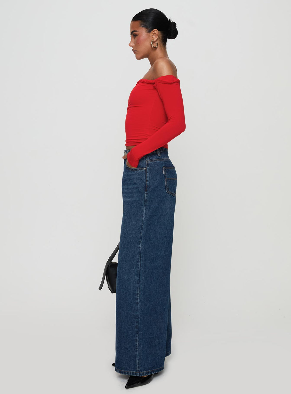 side view of model wearing Princess Polly Naylor Rip Mid Rise Wide Leg Jeans Dark Blue Wash Mid Rise Jeans Jeans 