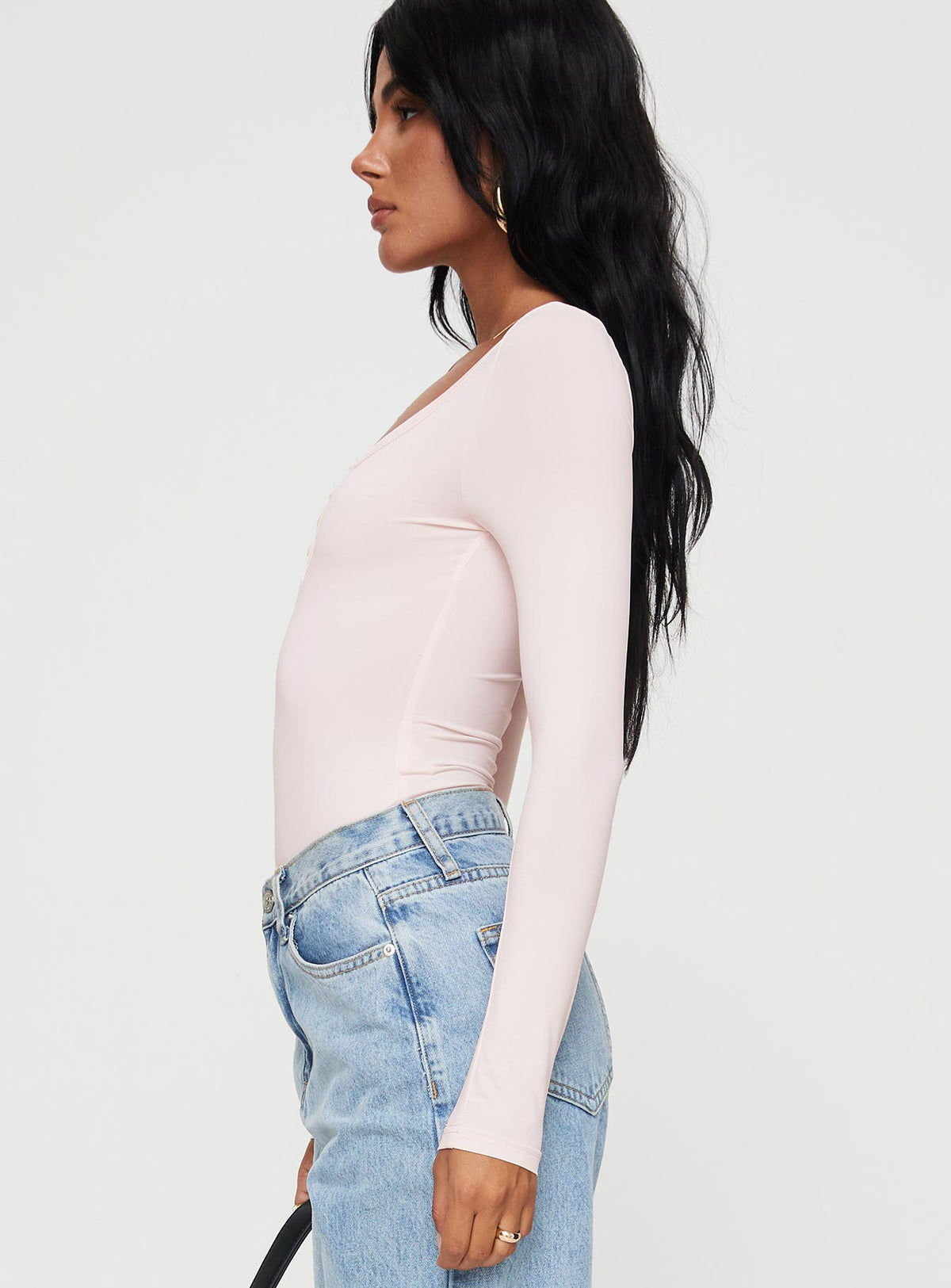 side view of model wearing Princess Polly Delgado Long Sleeve Bodysuit Pink Long Sleeve Tops Bodysuit 