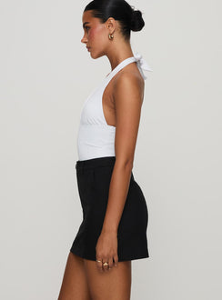   side view of model wearing Princess Polly Sabyna Tailored Mini Skirt Black Mini Skirts Skirts 