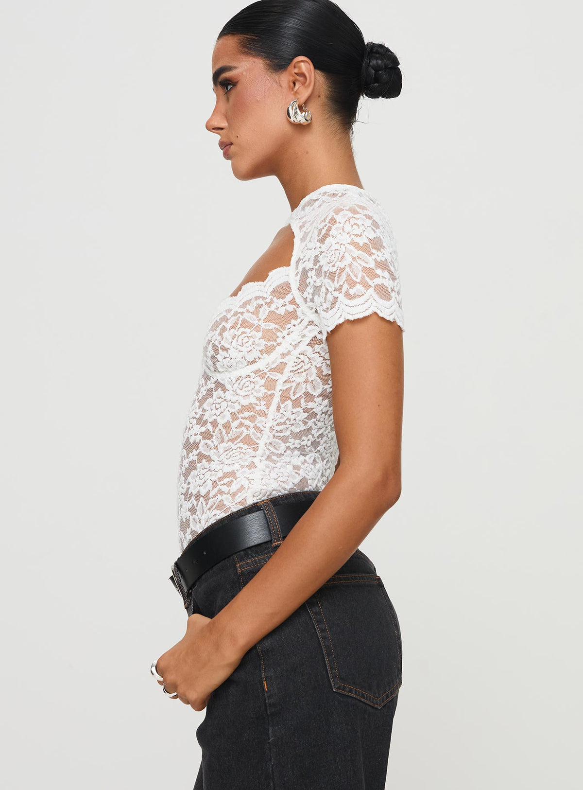side view of model wearing Princess Polly Giallo Bodysuit White Short Sleeve Bodysuit 