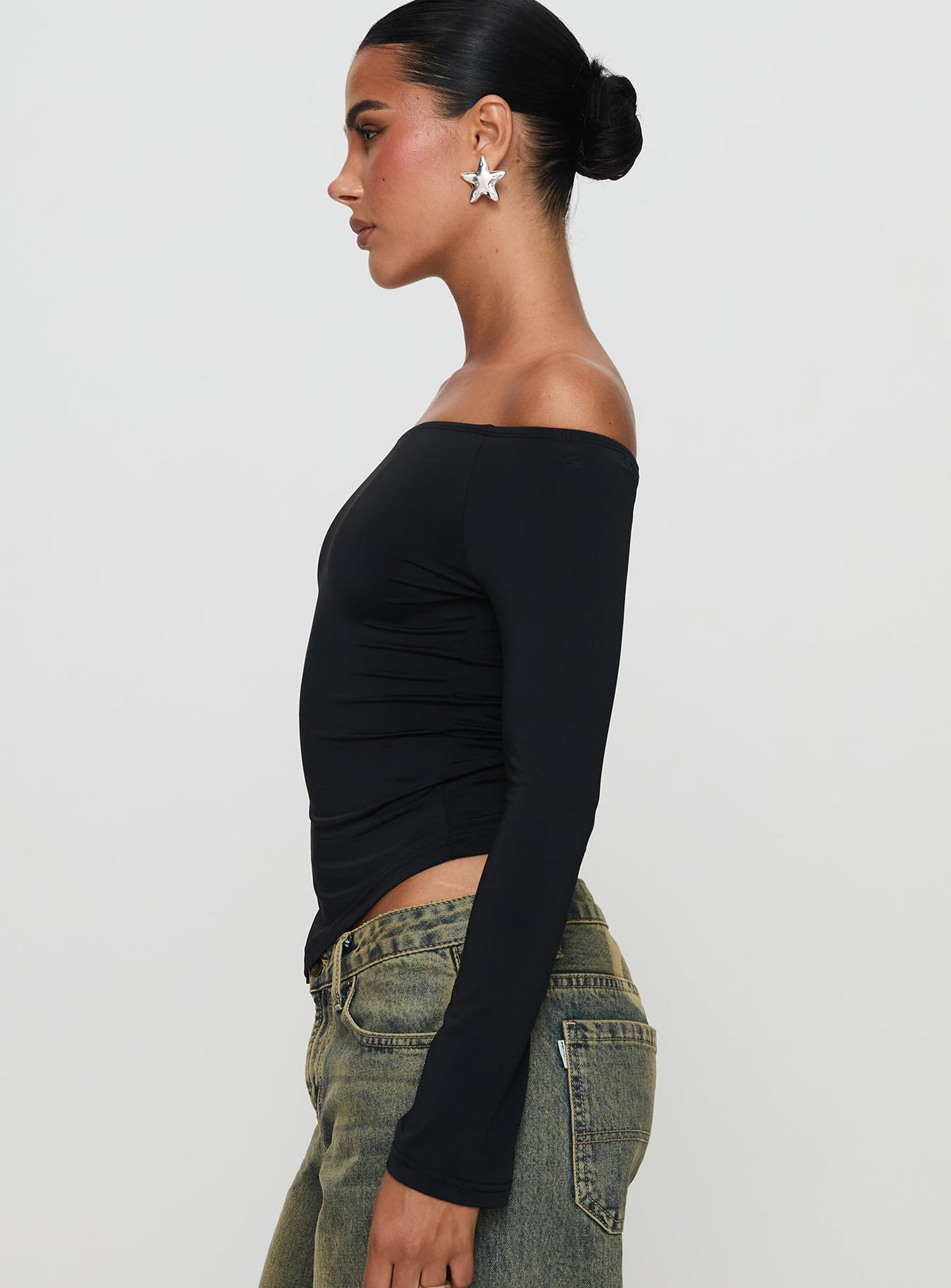 side view of model wearing Princess Polly Endellion Off Shoulder Long Sleeve Top Black Full Sleeves straight 