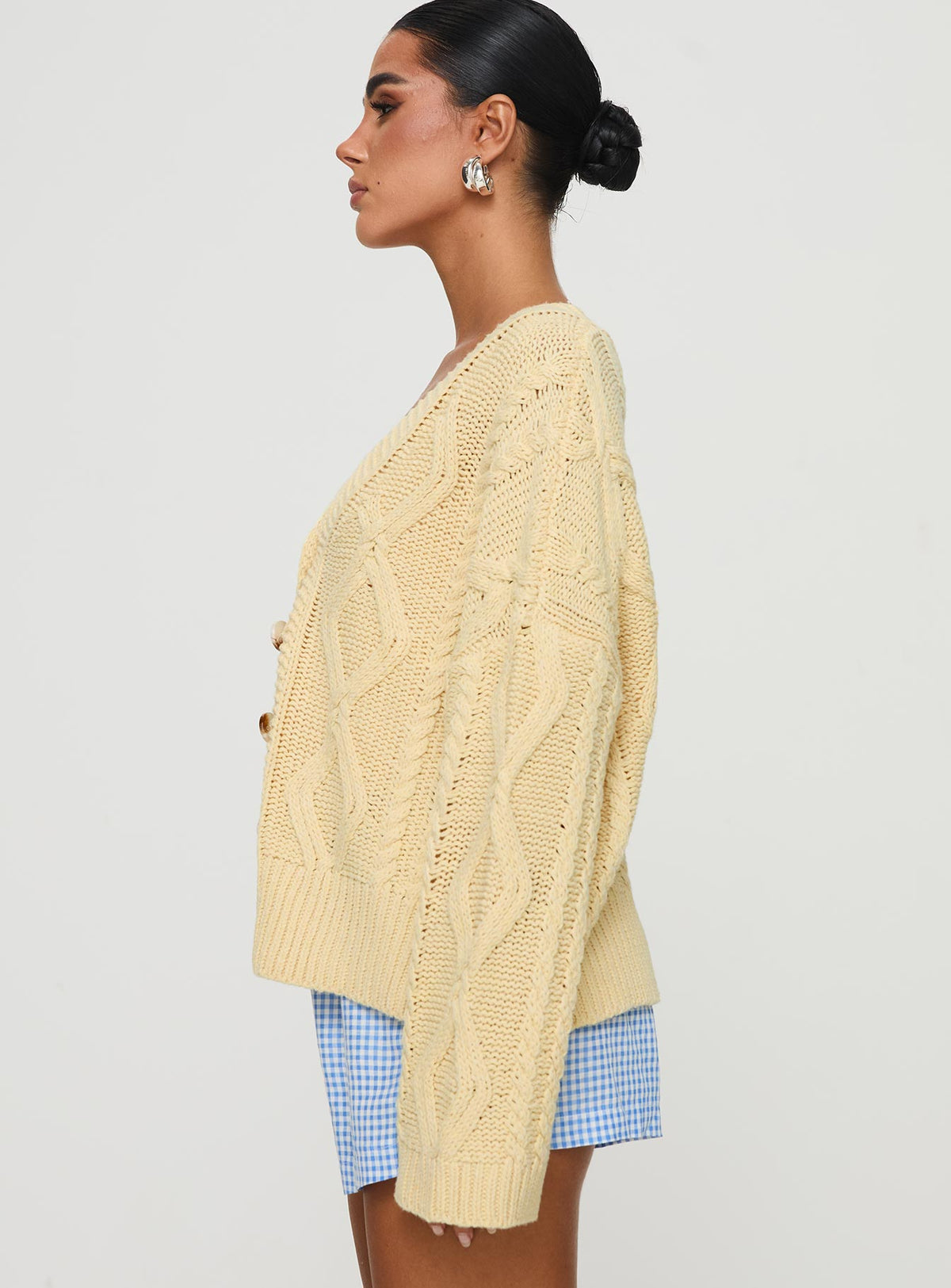 side view of model wearing Princess Polly Daxtan Cable Cardigan Lemon Cropped Jumpers Jumpers 