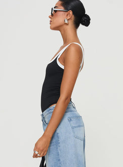 side view of model wearing Princess Polly Astrea Bodysuit Black / White Sleeveless Bodysuit 