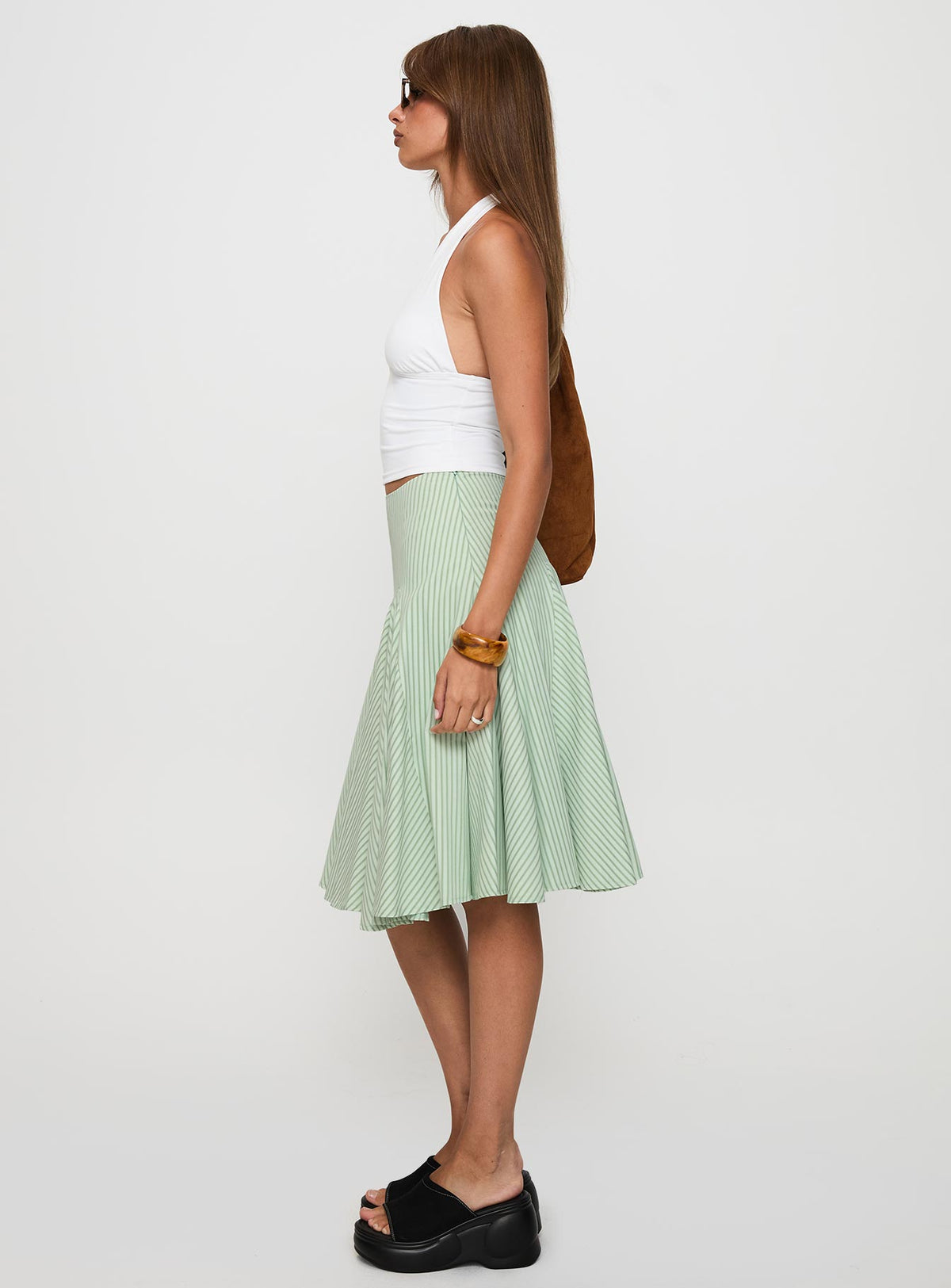   side view of model wearing Princess Polly Evangaleine Pleat Midi Skirt Green / White Midi Skirts Skirts 