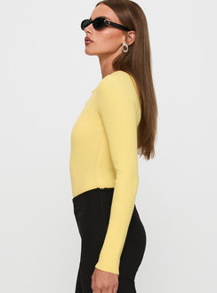 side view of model wearing Princess Polly Kerra Long Sleeve Bodysuit Lemon Long Sleeve Tops Bodysuit 