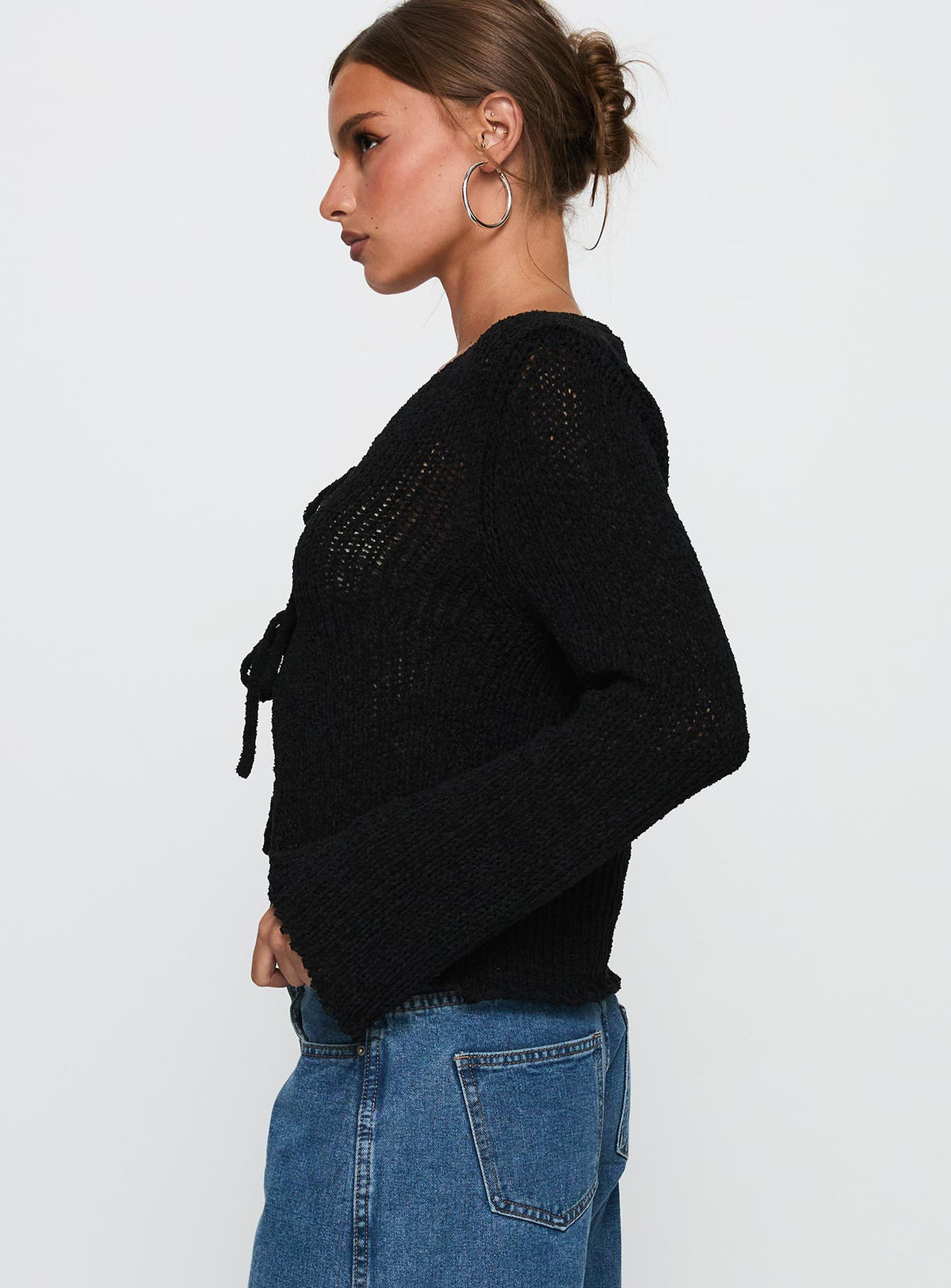 side view of model wearing Princess Polly Swain Knit Cardigan Black Cropped Jumpers Jumpers 