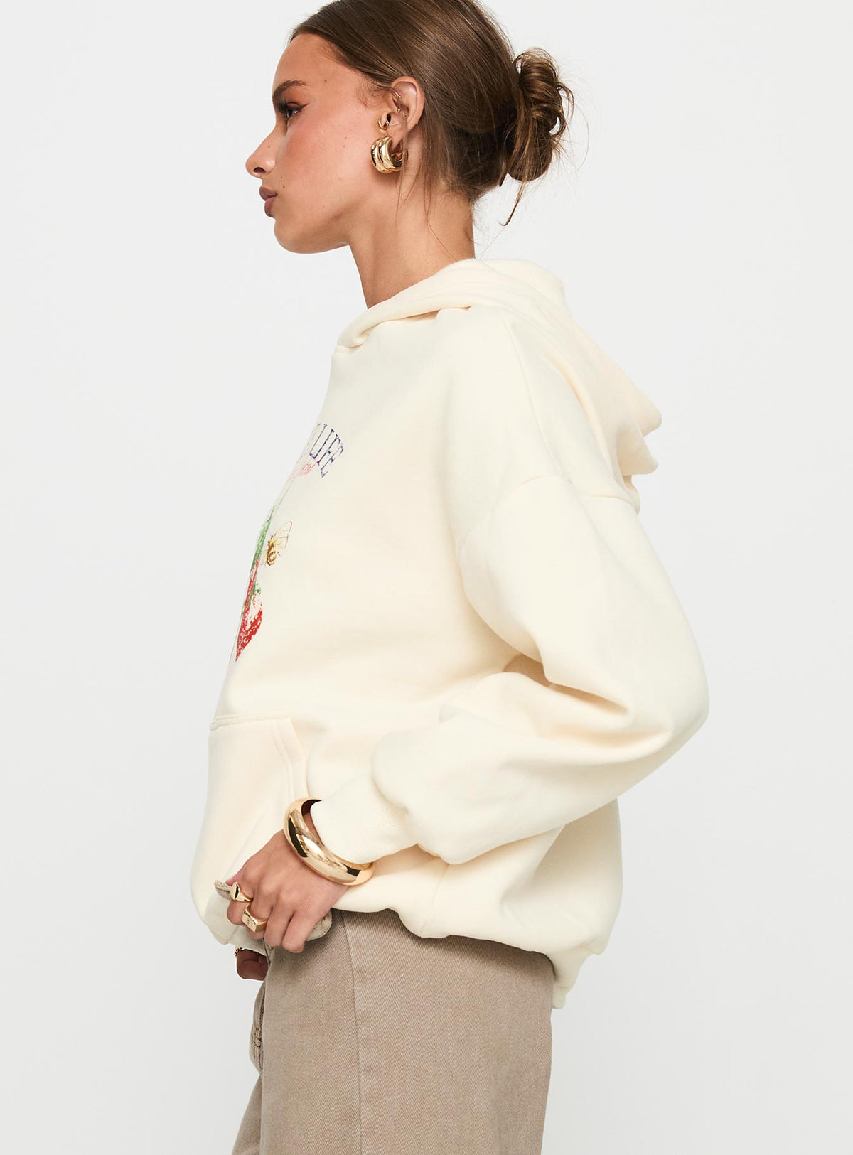 side view of model wearing Princess Polly Sweet Life Graphic Sweater Cream Longline Jumpers Jumpers 