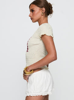 side view of model wearing Princess Polly Ciao Bella Shirred Graphic Top Cream Short Sleeves Crew Neck 